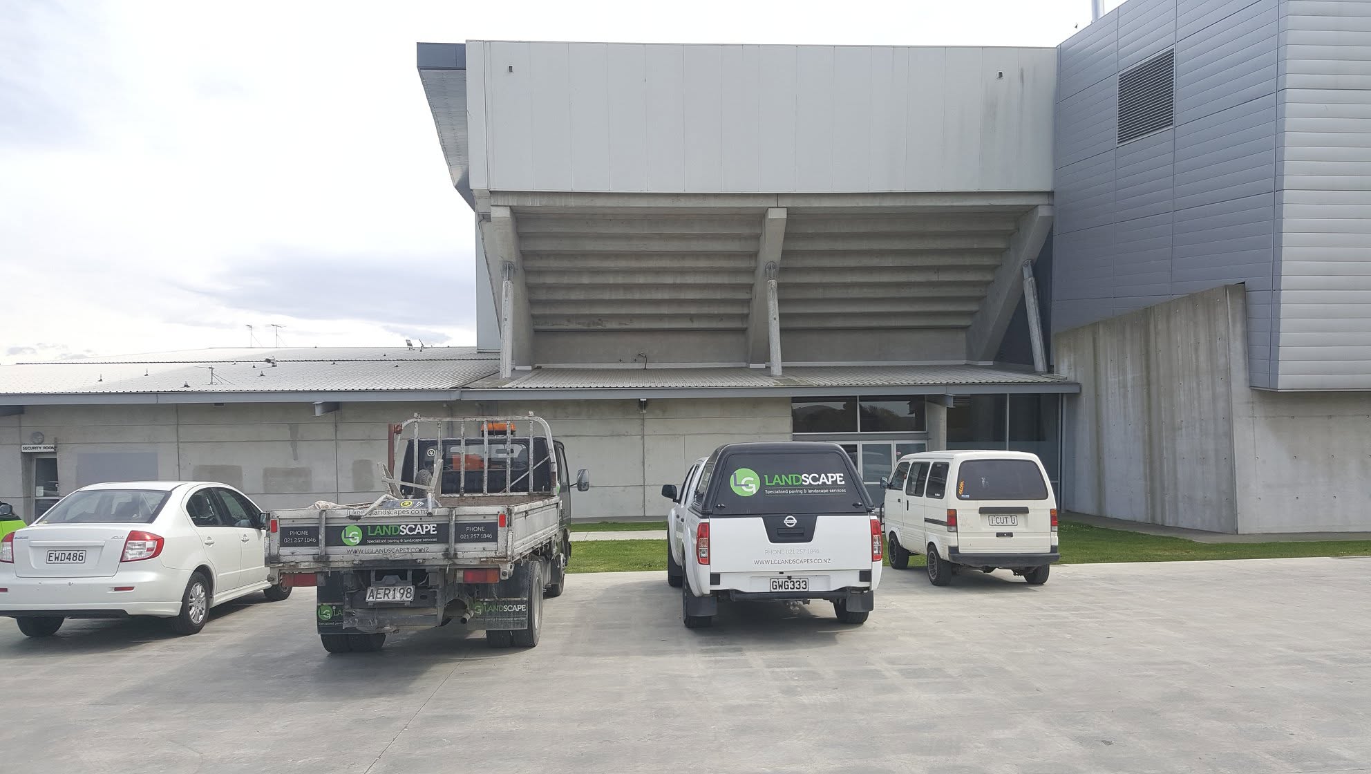 LG Landscapes work utes on site at a commercial building